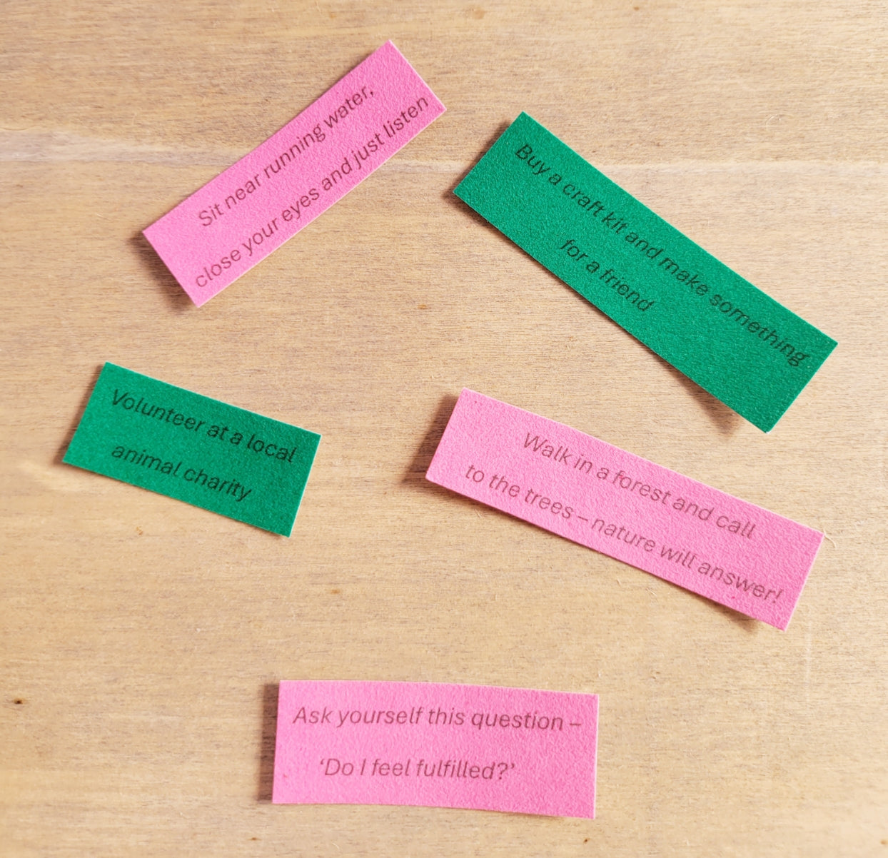 green and pink paper quotes each with a different instruction