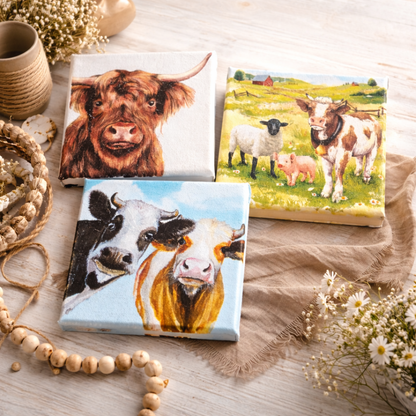 Three small canvas pictures with cow and farmyard scenes 