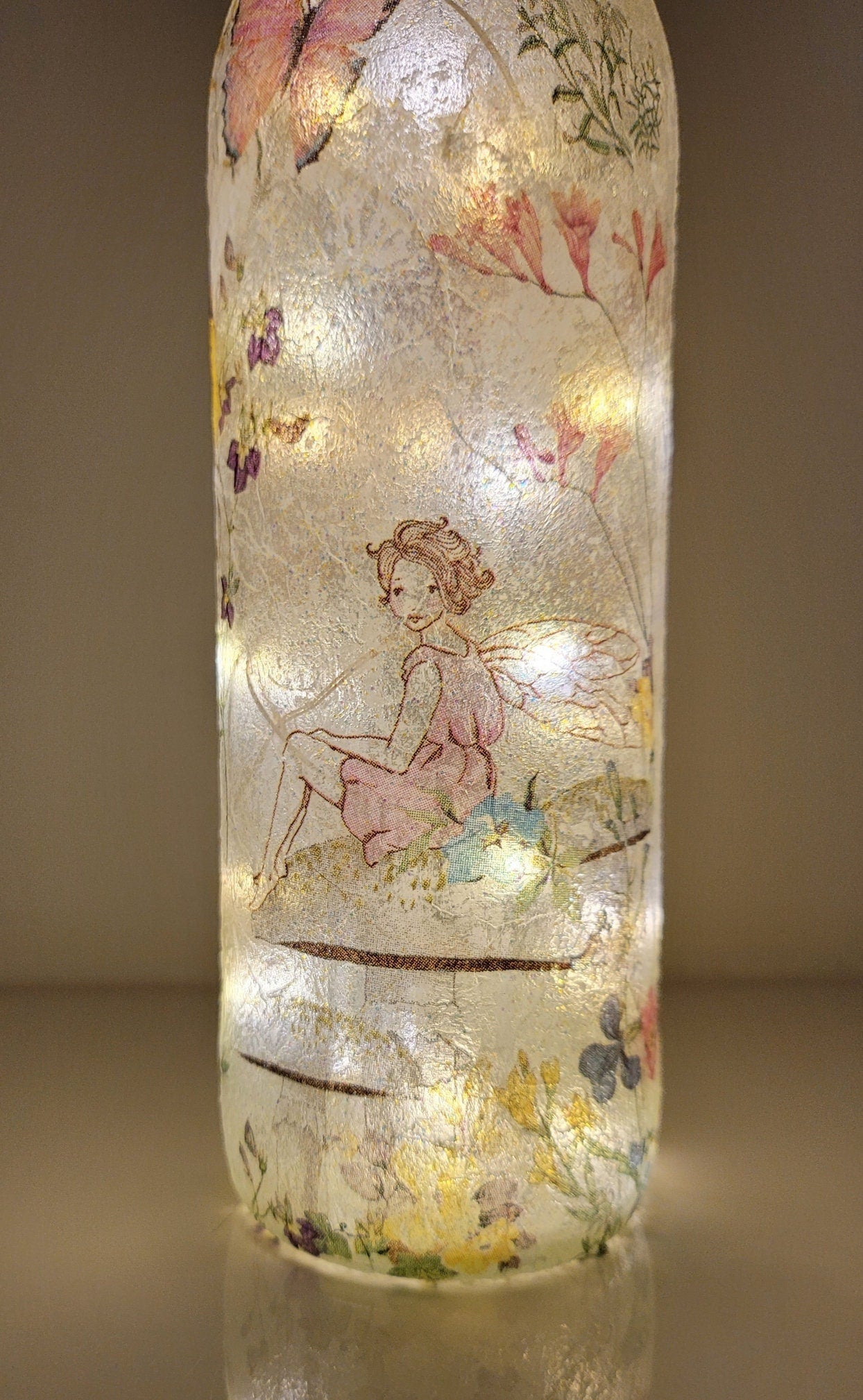 Decoupage Fairy bottle lamp - Lit up standard wine bottle with Fairy and flower butterfly detailing. Cork LED lights