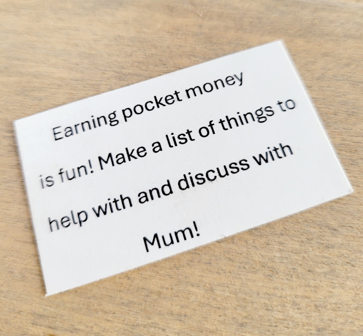 white card with the quote 'earning pocket money is fun! Make a list of things to do and discuss with Mum!'
