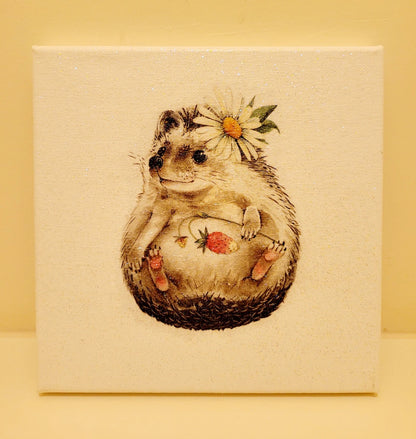 Decoupage image of a hedgehog on a white canvas