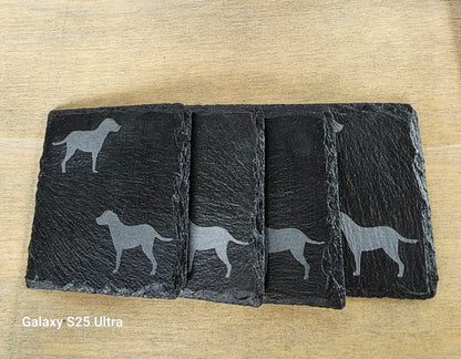 Four black slate coasters each with two labrador etched images on - dogs facing eachother