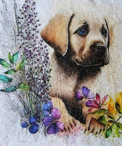 Artistic depiction of a golden labrador puppy surrounded by flowers on a white painted slate coaster
