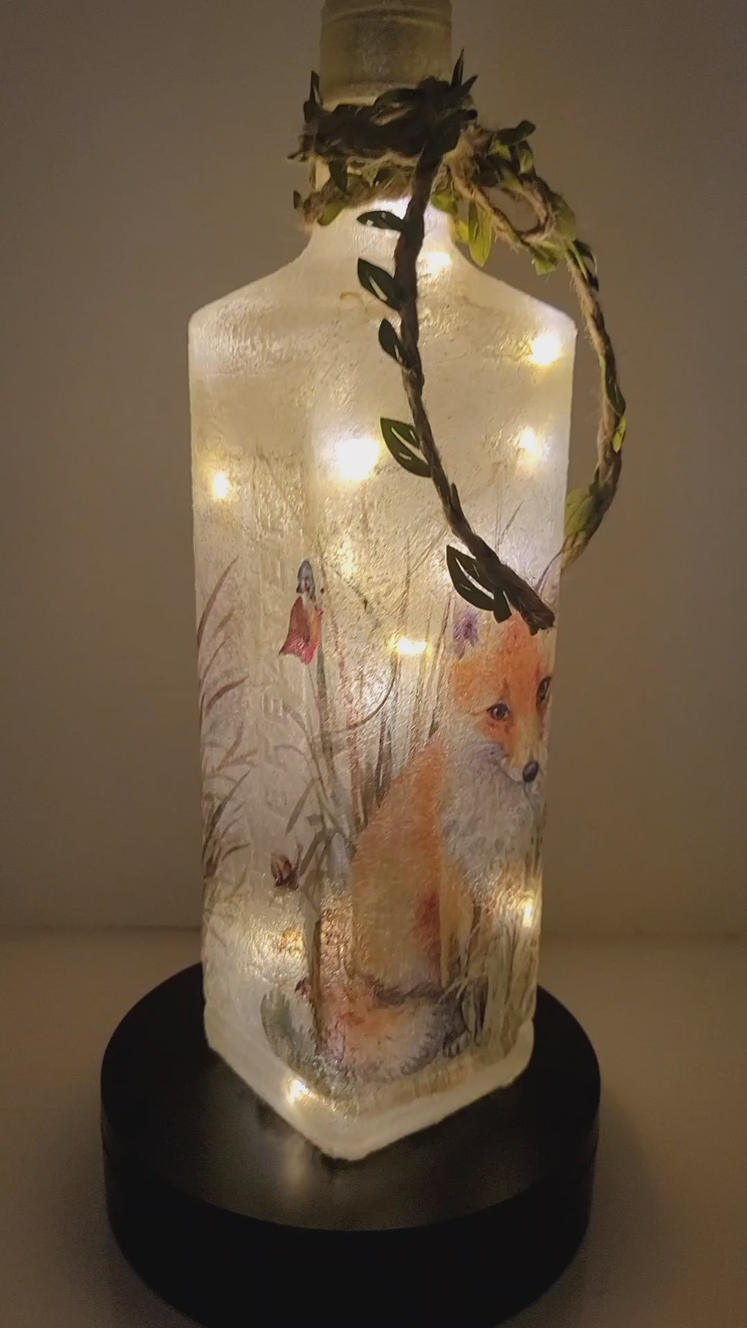 Rotating Lit up square bottle with Fox Image. Jute string with leaves