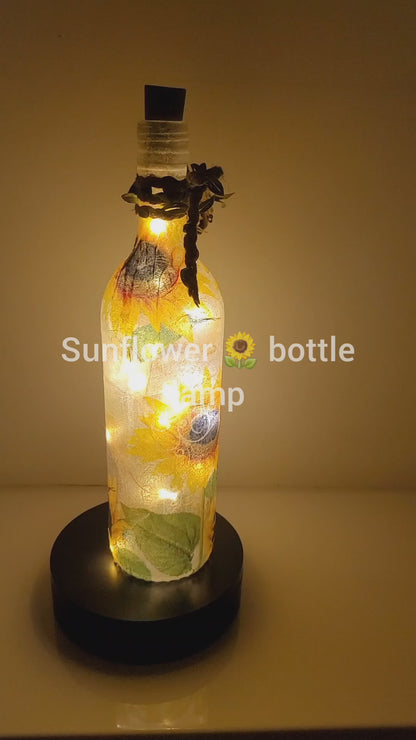 RLit up bottle with sunflower detail. Jute string bow with leavesotating 
