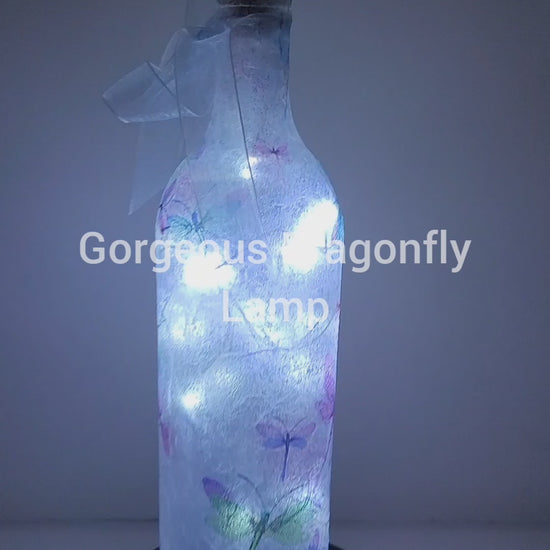 Rotating wine bottle with Dragonfly detail Pale blue bow