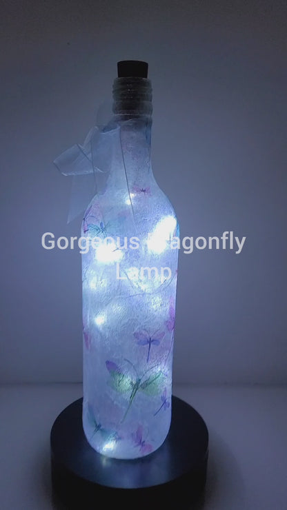 Rotating wine bottle with Dragonfly detail Pale blue bow