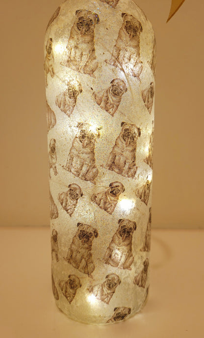 wine bottle decorated with tiny pug dog images. 