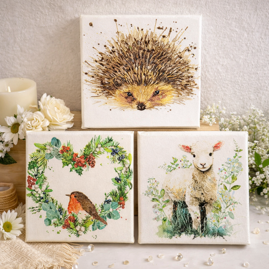 Set of three decorative pictures canvas featuring a hedgehog, robin, and lamb 