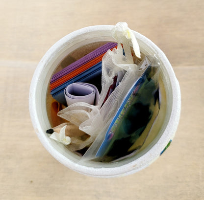 white painted jar with contents inside