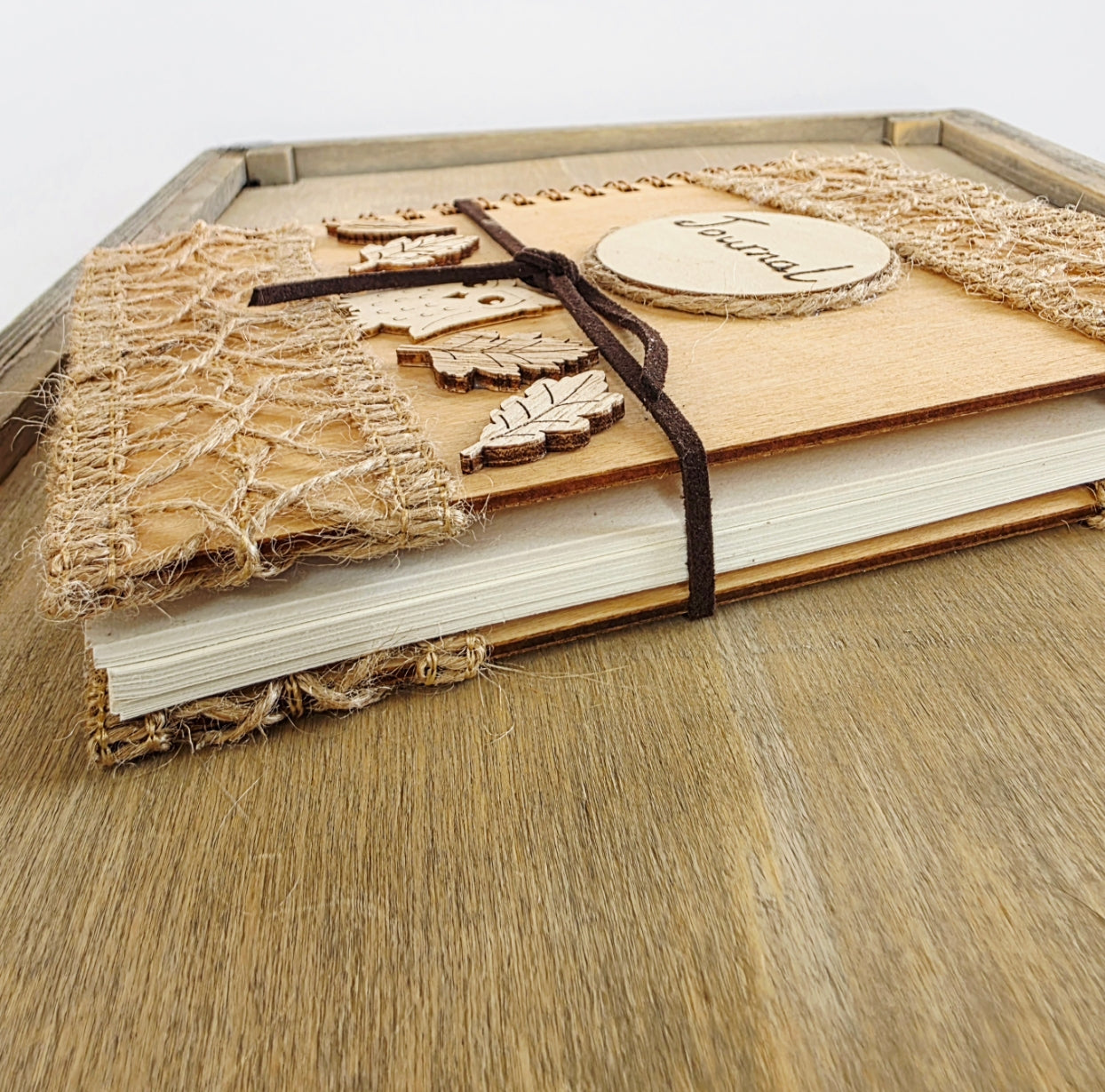 Wooden journal with decorative woodland elements. Faux suede tie. 